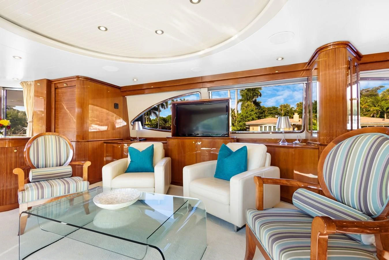 a living room with a large tv aboard CRISTALES Yacht for Sale