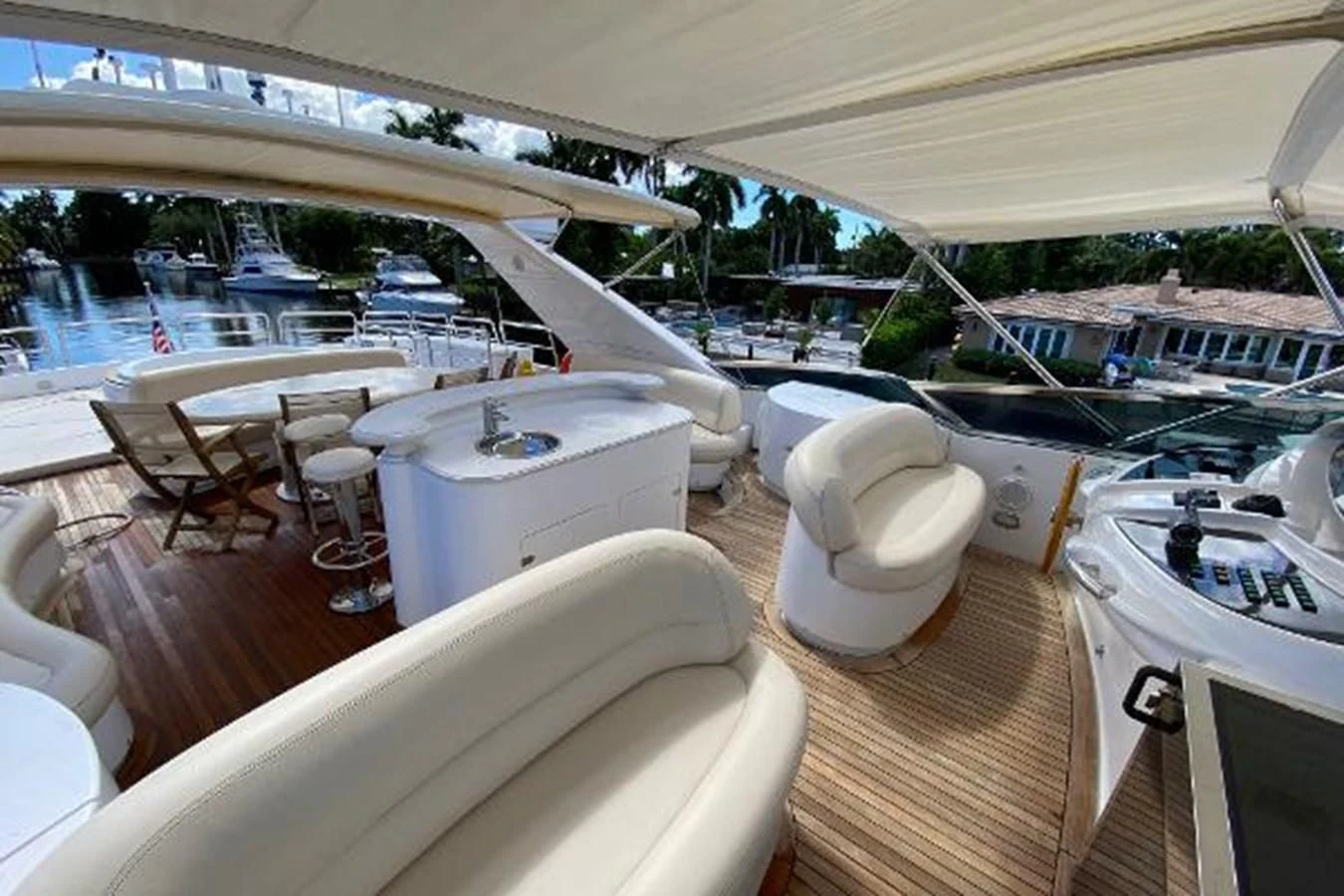 a boat with chairs and tables aboard CRISTALES Yacht for Sale