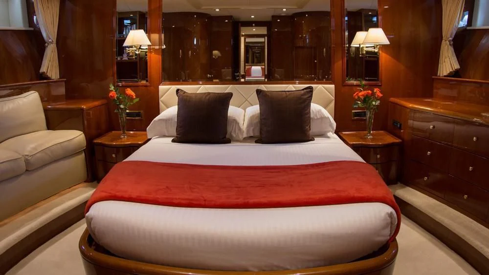 a bed with pillows and pillows aboard CRISTALES Yacht for Sale