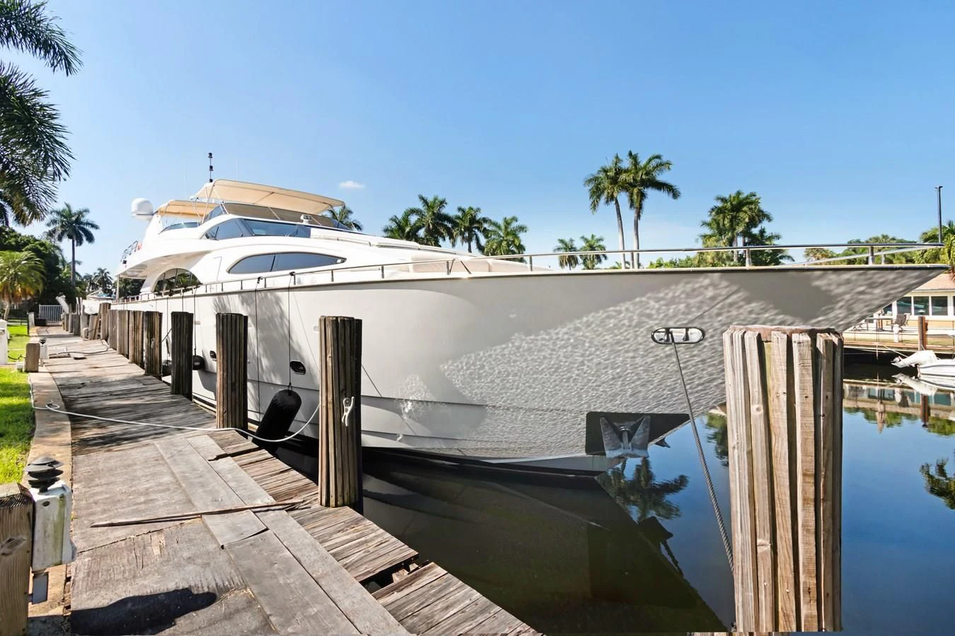 a white building with a roof and a pool of water aboard CRISTALES Yacht for Sale
