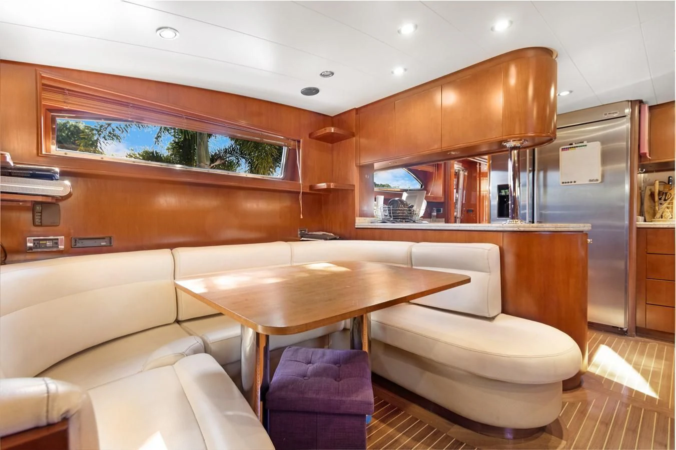 a room with a table and chairs aboard CRISTALES Yacht for Sale