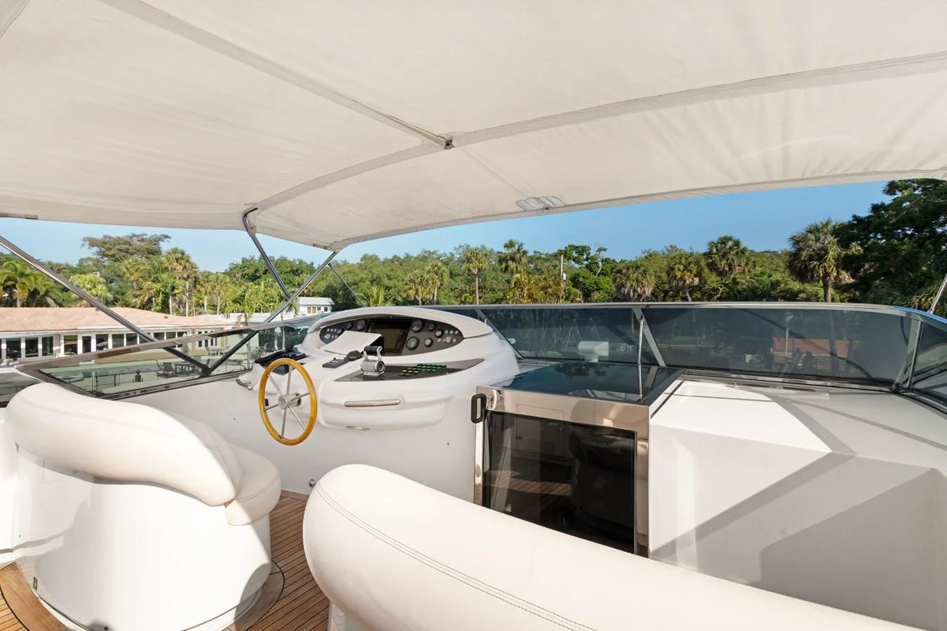 a white car with a yellow tag on the front aboard CRISTALES Yacht for Sale