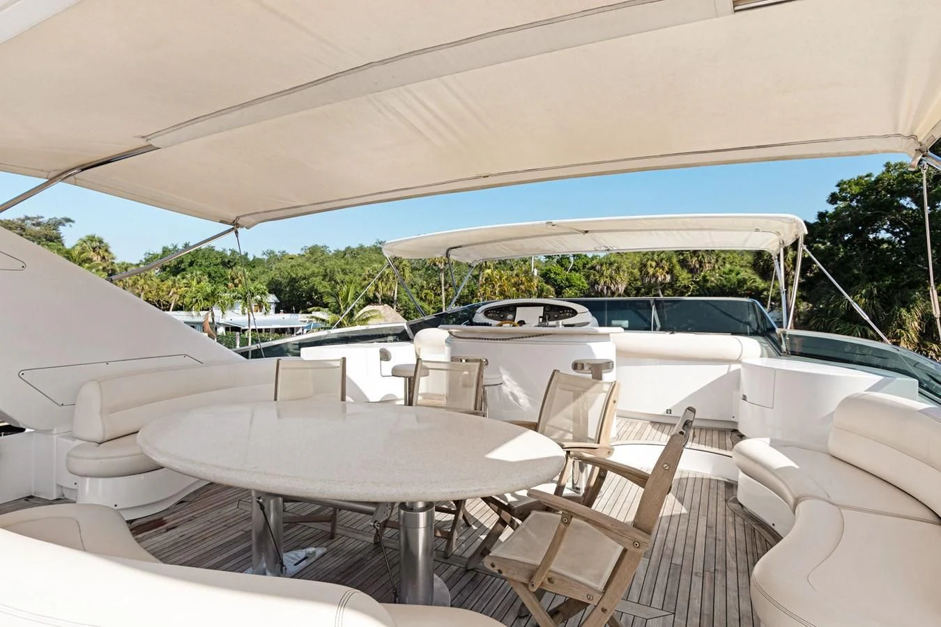 a tent with tables and chairs aboard CRISTALES Yacht for Sale