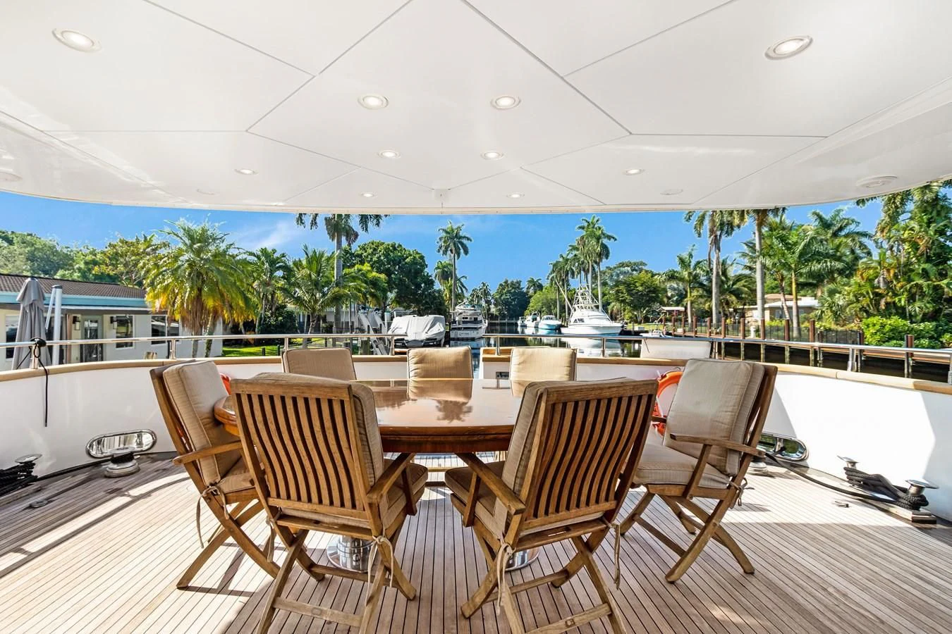a deck with chairs and tables aboard CRISTALES Yacht for Sale