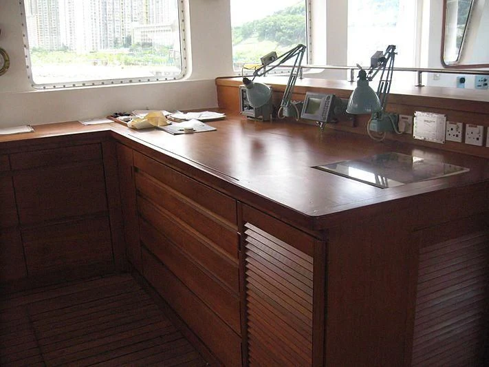 a kitchen with a sink and a window aboard VAN TRIUMPH Yacht for Sale
