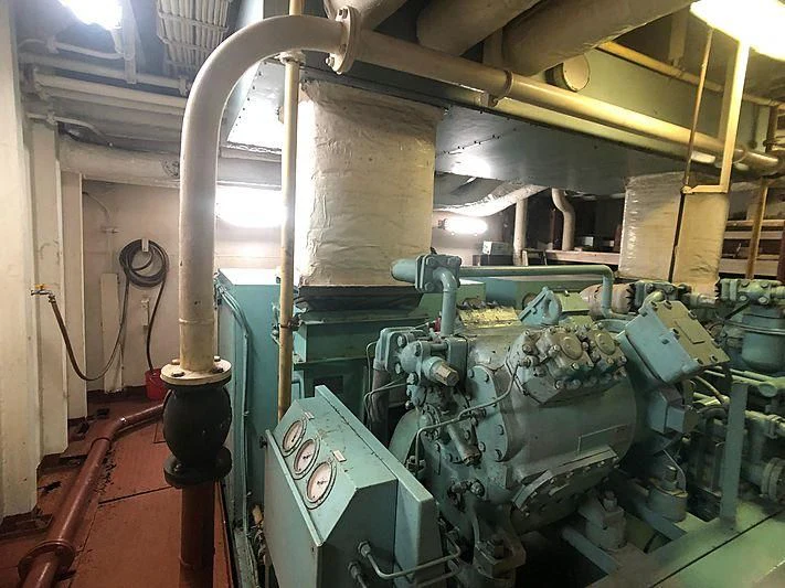 a large machine in a room aboard VAN TRIUMPH Yacht for Sale