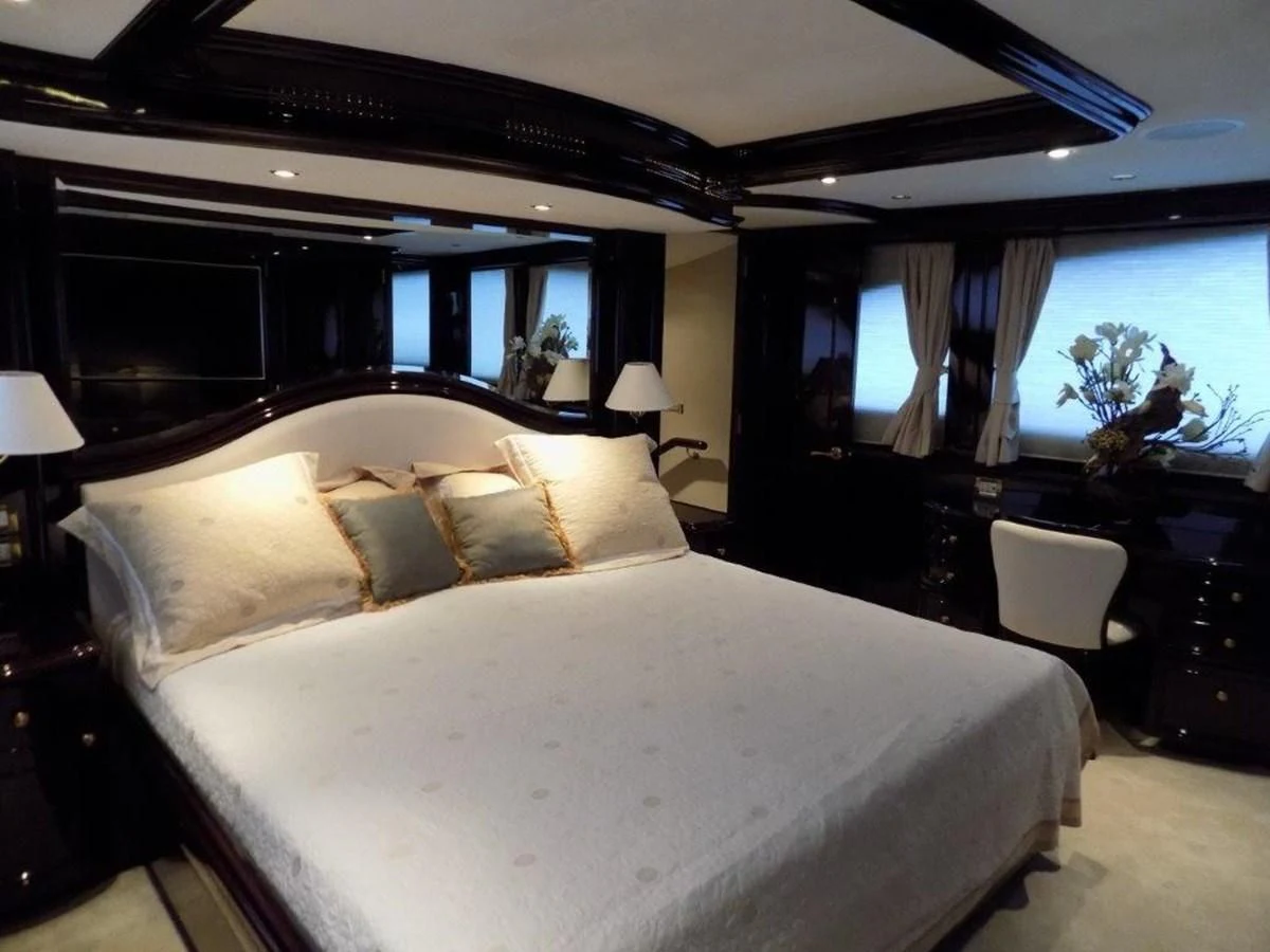 a large bed in a hotel room aboard BENDIS Yacht for Sale