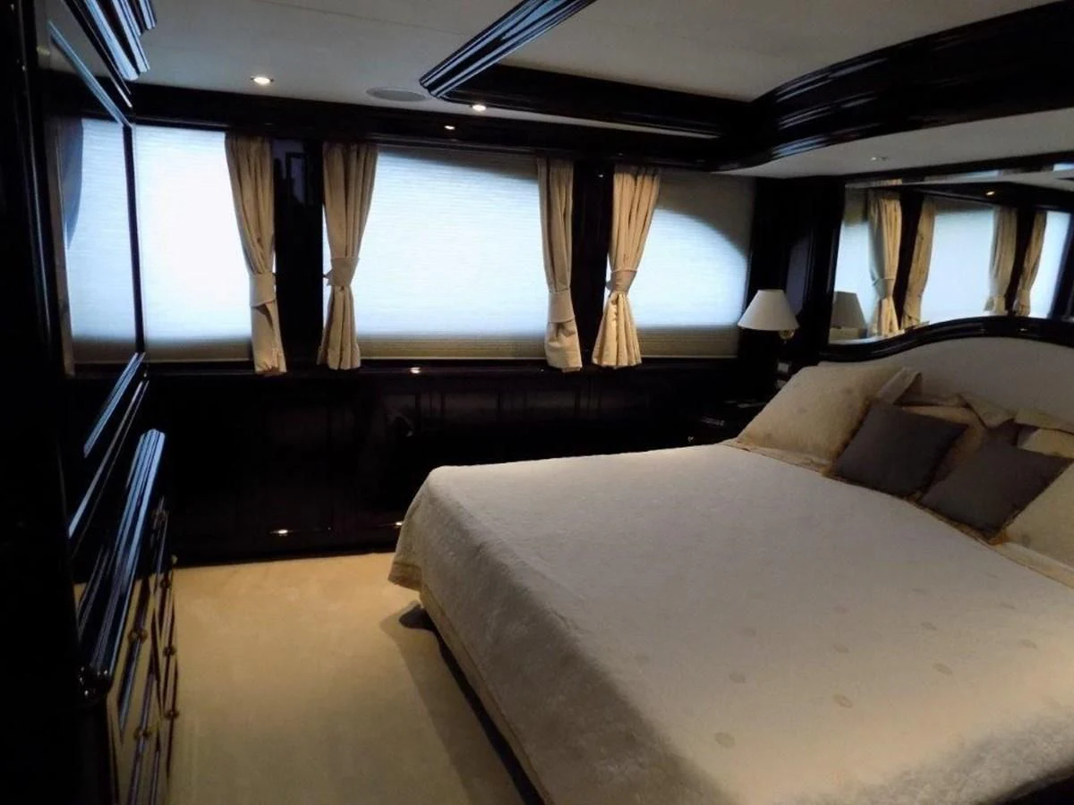a room with a bed and a window aboard BENDIS Yacht for Sale