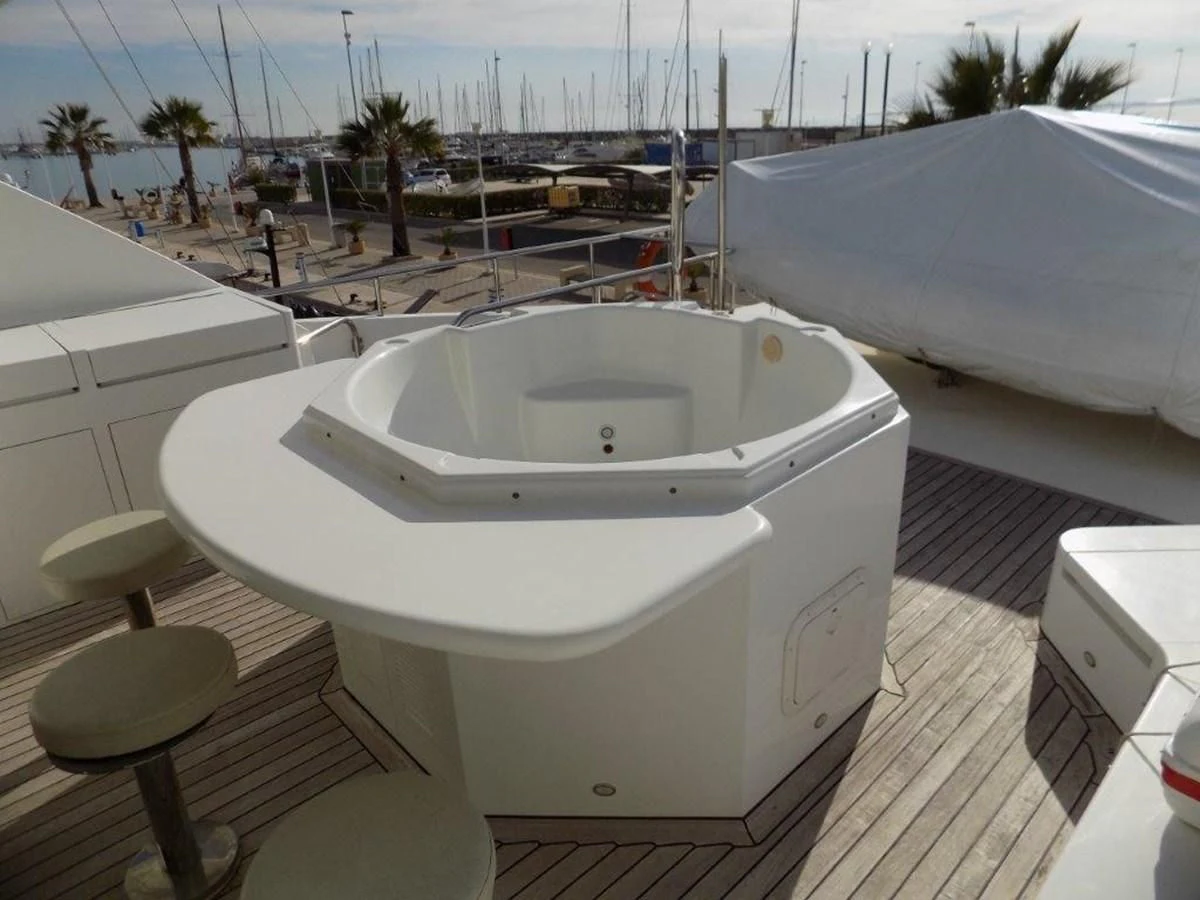 a white bathtub on a deck aboard BENDIS Yacht for Sale