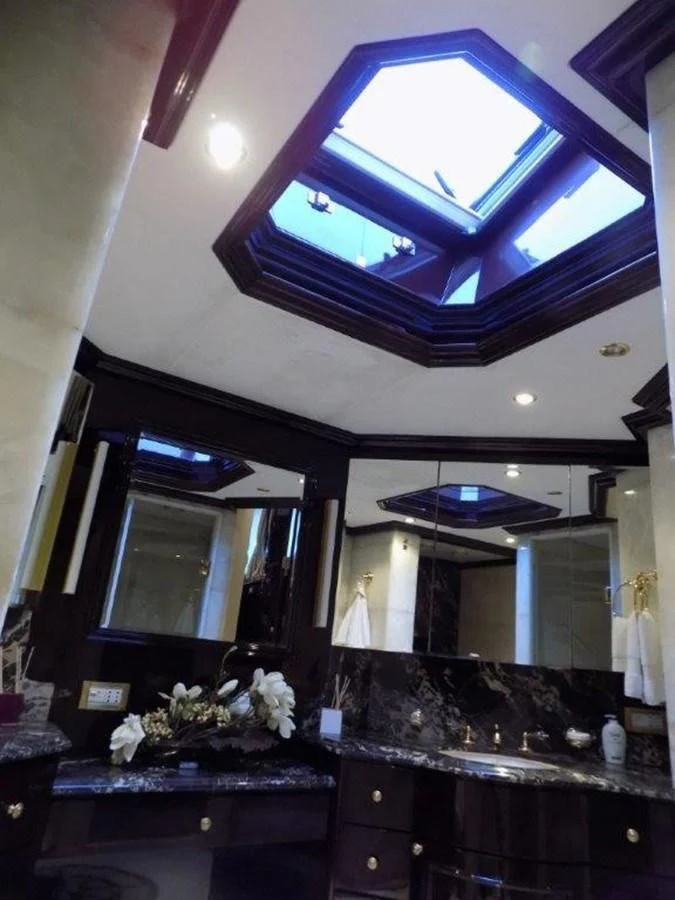 a kitchen with a large window aboard BENDIS Yacht for Sale