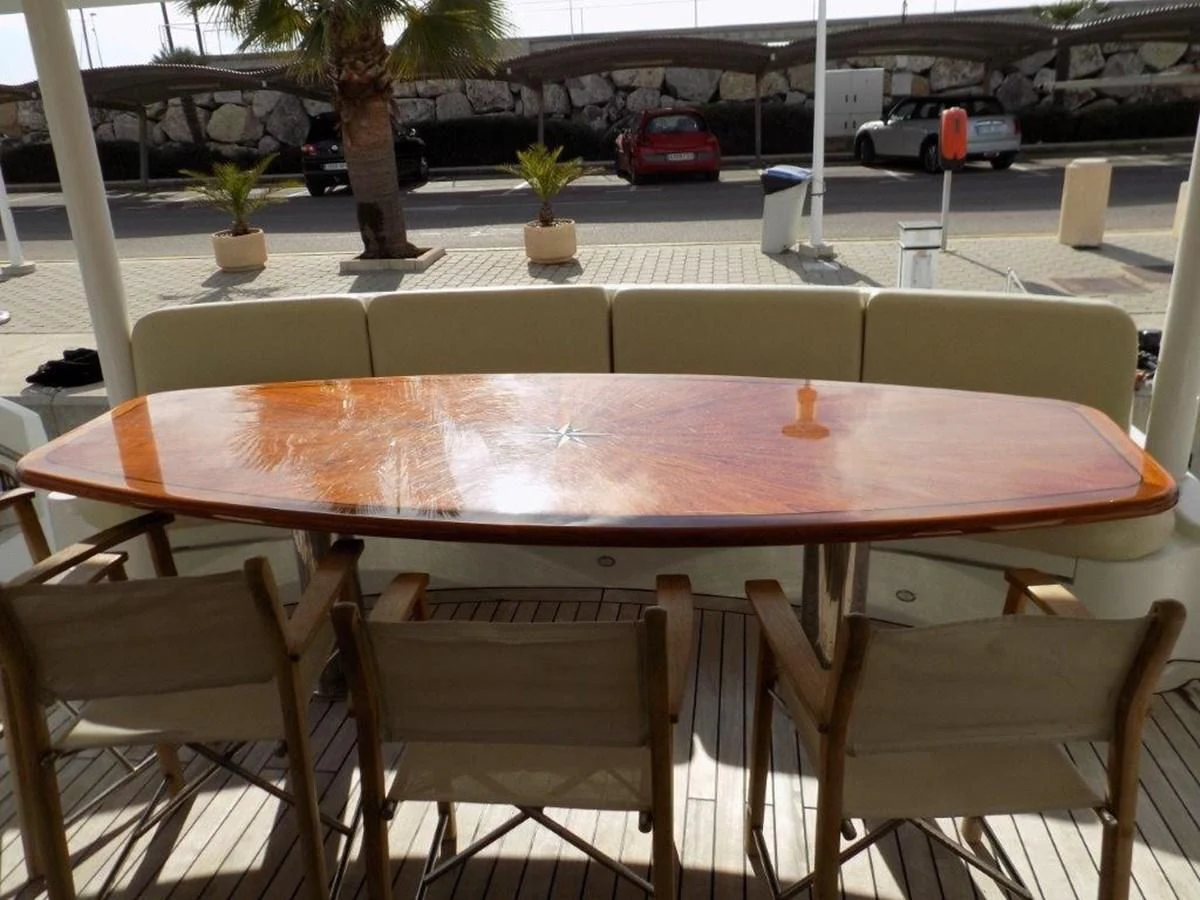 a table with chairs around it aboard BENDIS Yacht for Sale
