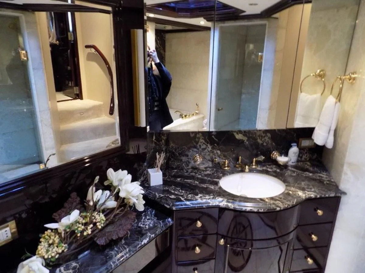 a bathroom with a large mirror aboard BENDIS Yacht for Sale