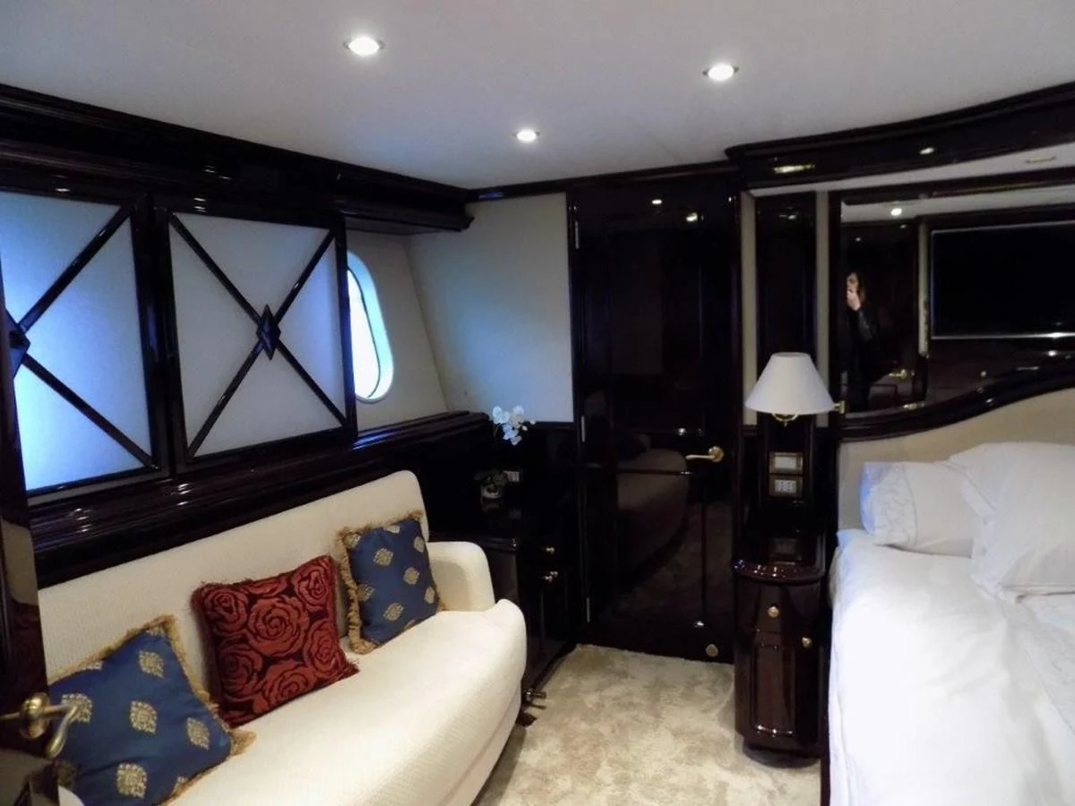 a living room with a large mirror aboard BENDIS Yacht for Sale