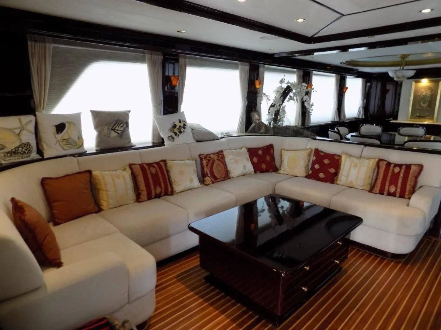 a living room with a couch and a coffee table aboard BENDIS Yacht for Sale