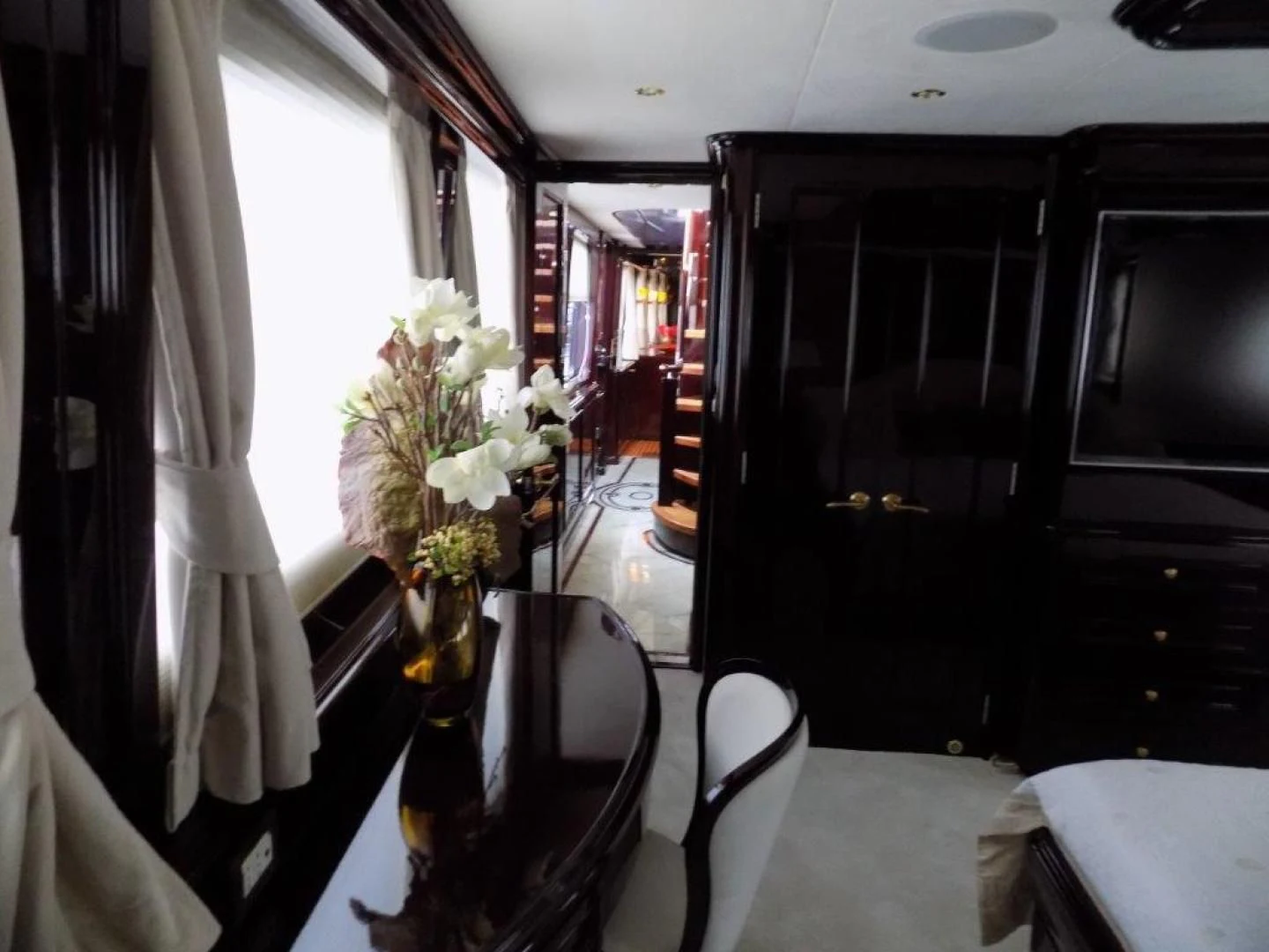a vase of flowers on a table aboard BENDIS Yacht for Sale