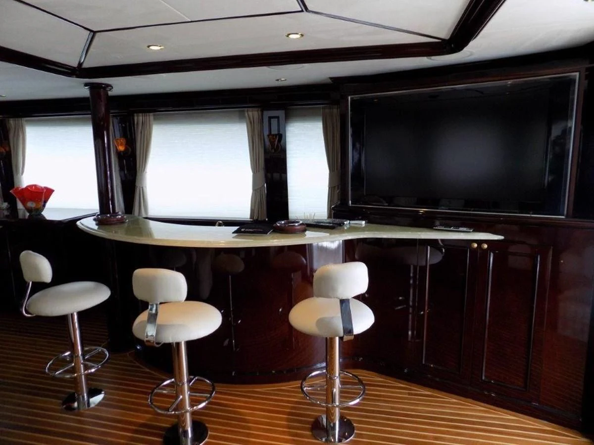 a room with a table and chairs aboard BENDIS Yacht for Sale