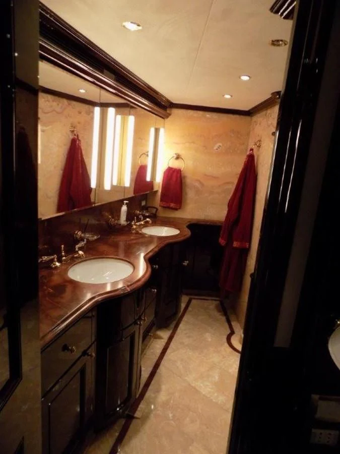 a bathroom with a sink and a mirror aboard BENDIS Yacht for Sale