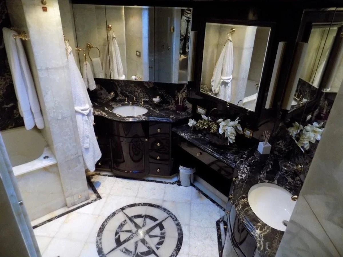 a bathroom with a sink and a mirror aboard BENDIS Yacht for Sale