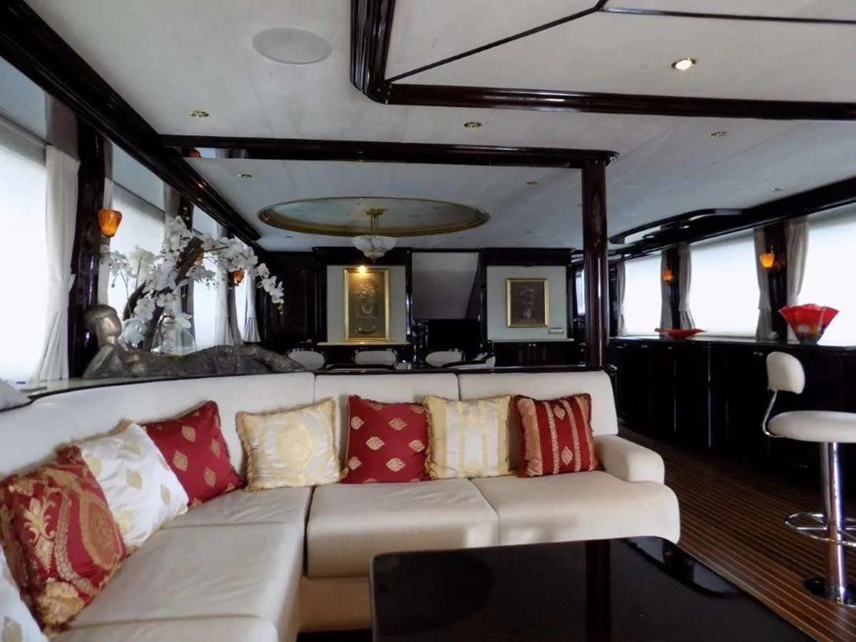 a living room with a couch and a mirror aboard BENDIS Yacht for Sale