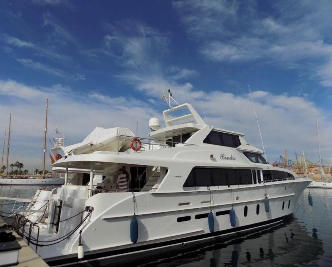 a boat docked at a pier aboard BENDIS Yacht for Sale