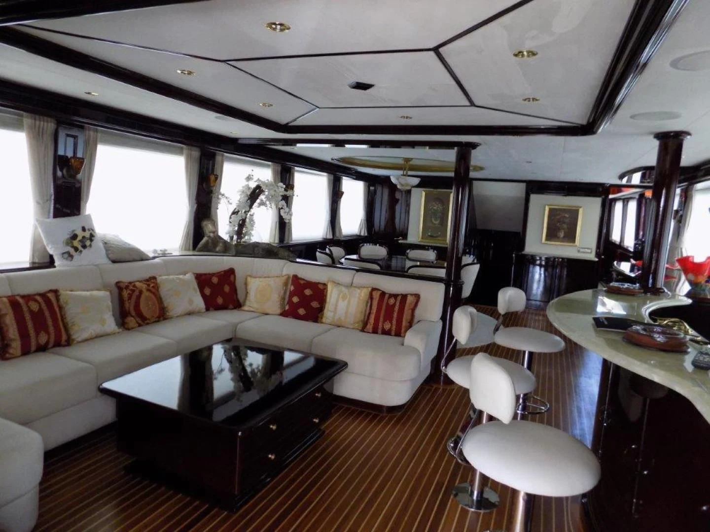 a living room with a couch and a coffee table aboard BENDIS Yacht for Sale