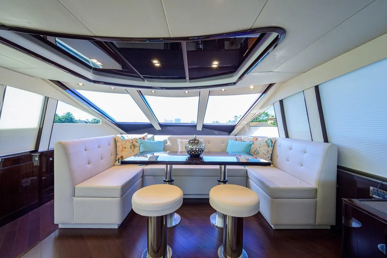 a room with a table and chairs aboard LADY NADIA Yacht for Sale