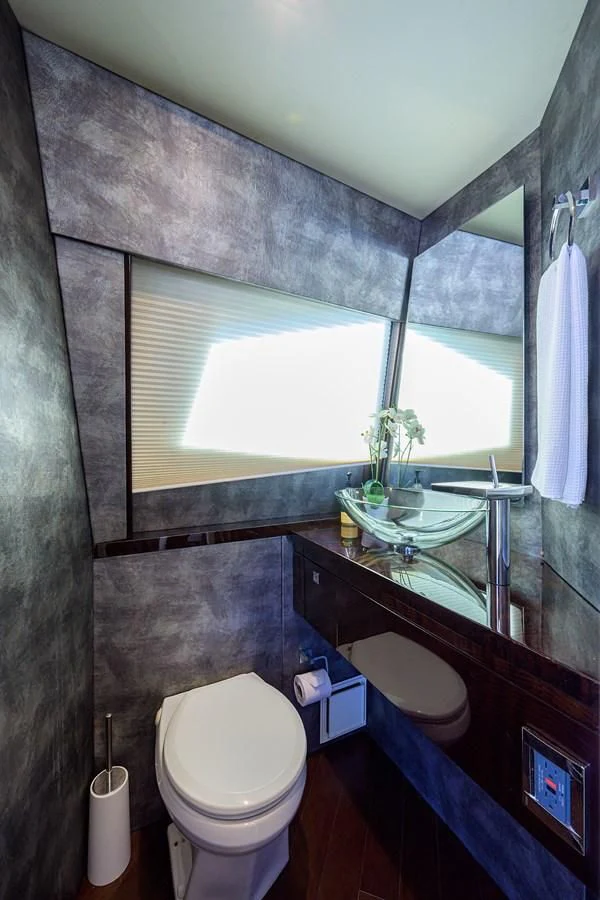a bathroom with a sink and a toilet aboard LADY NADIA Yacht for Sale