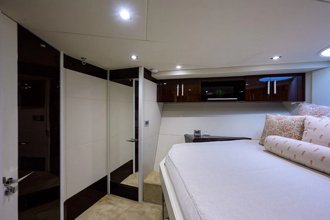 a bedroom with a bed and a closet aboard LADY NADIA Yacht for Sale