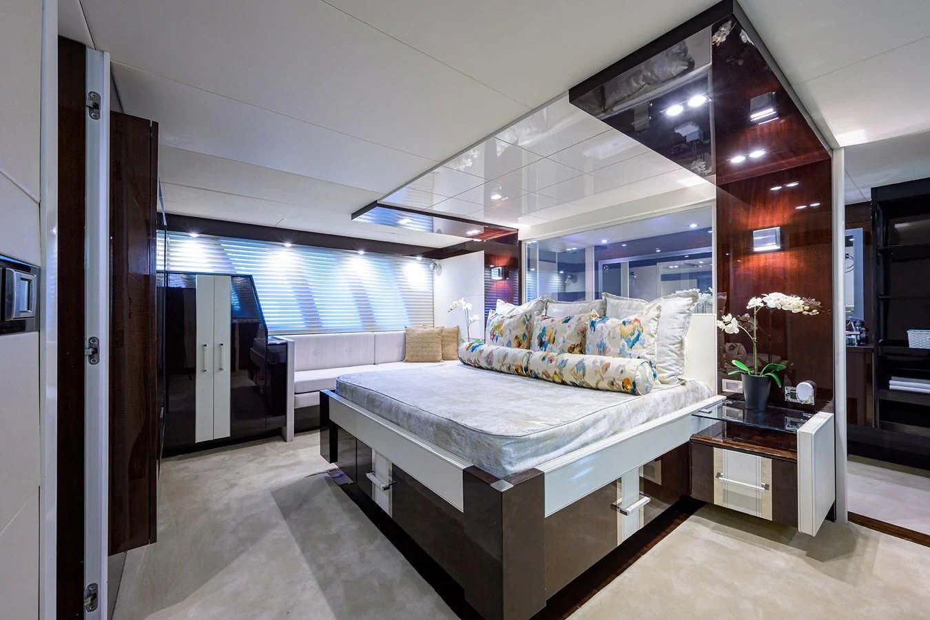 a room with a bed and a window aboard LADY NADIA Yacht for Sale