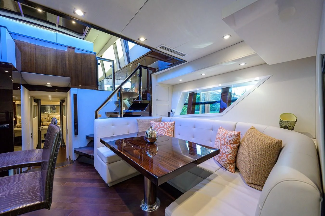 a living room with a table and chairs aboard LADY NADIA Yacht for Sale