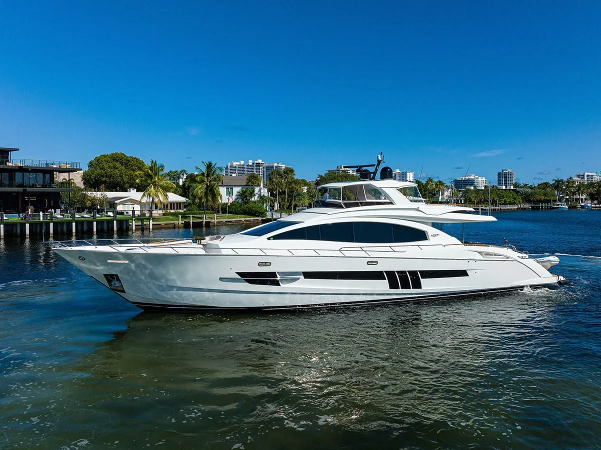 a white boat in a body of water aboard LADY NADIA Yacht for Sale
