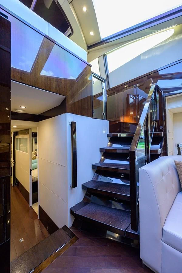 a staircase with a large staircase aboard LADY NADIA Yacht for Sale
