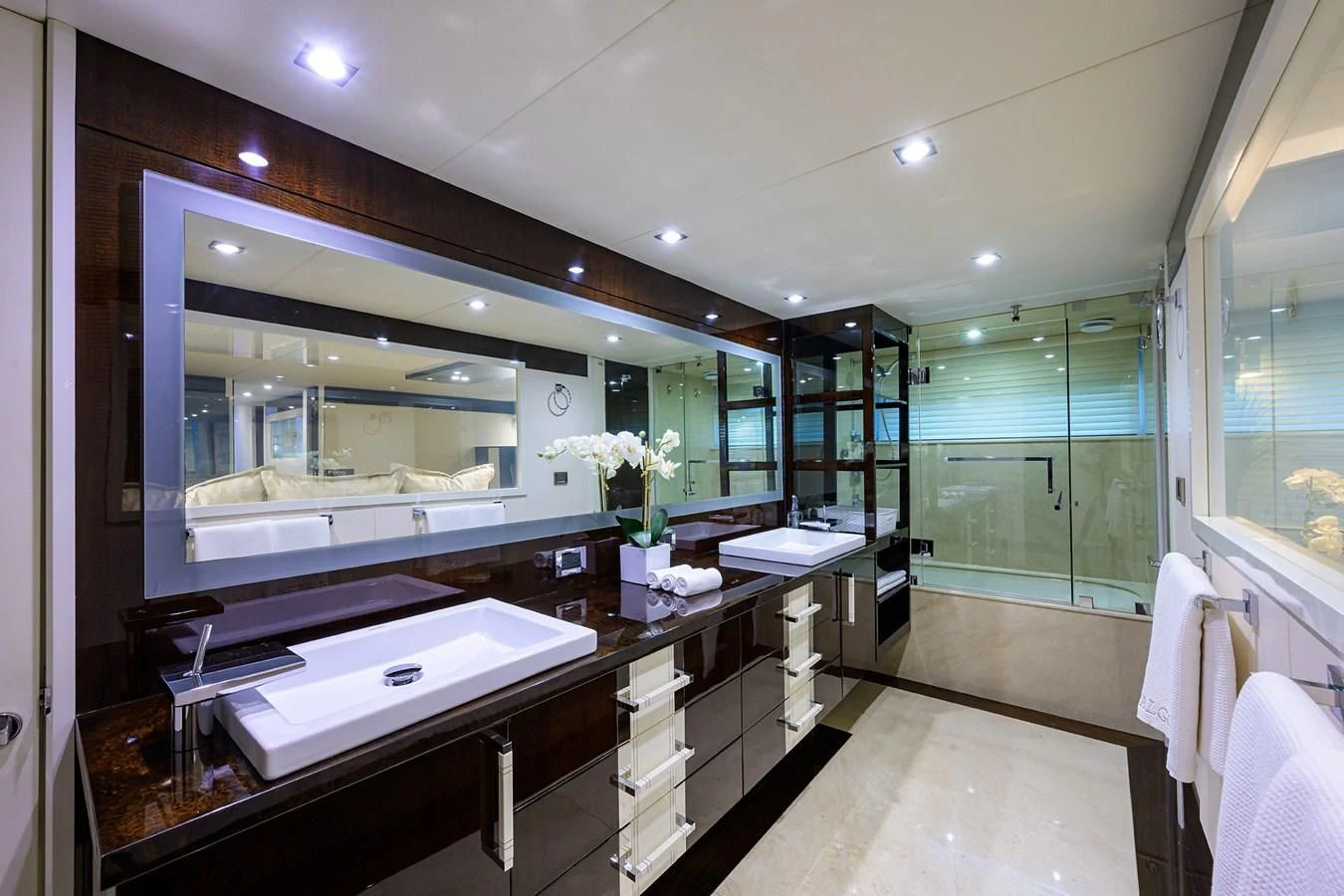 a bathroom with a large mirror aboard LADY NADIA Yacht for Sale