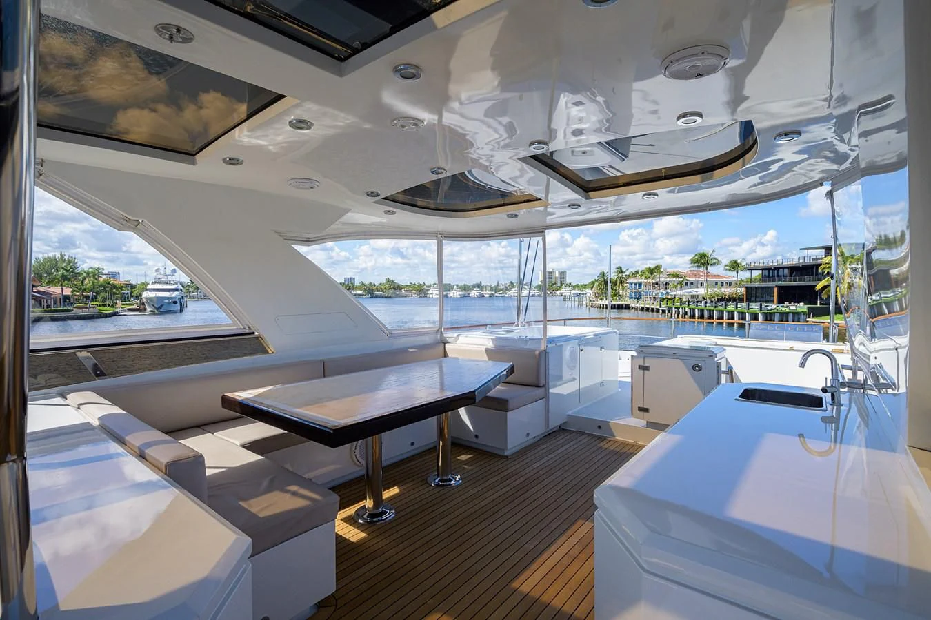 a room with a table and chairs aboard LADY NADIA Yacht for Sale