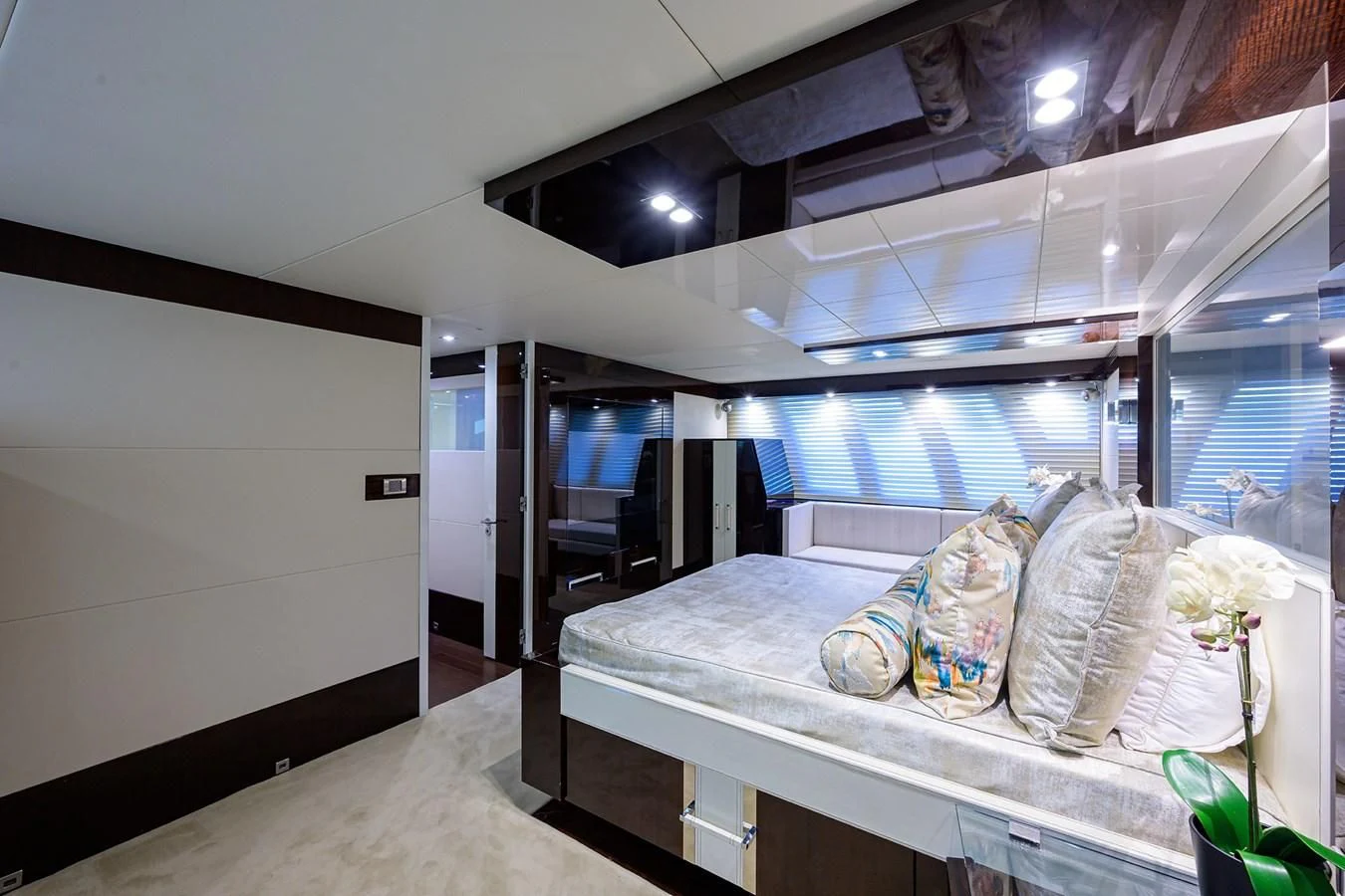 a room with a bed and a chair aboard LADY NADIA Yacht for Sale