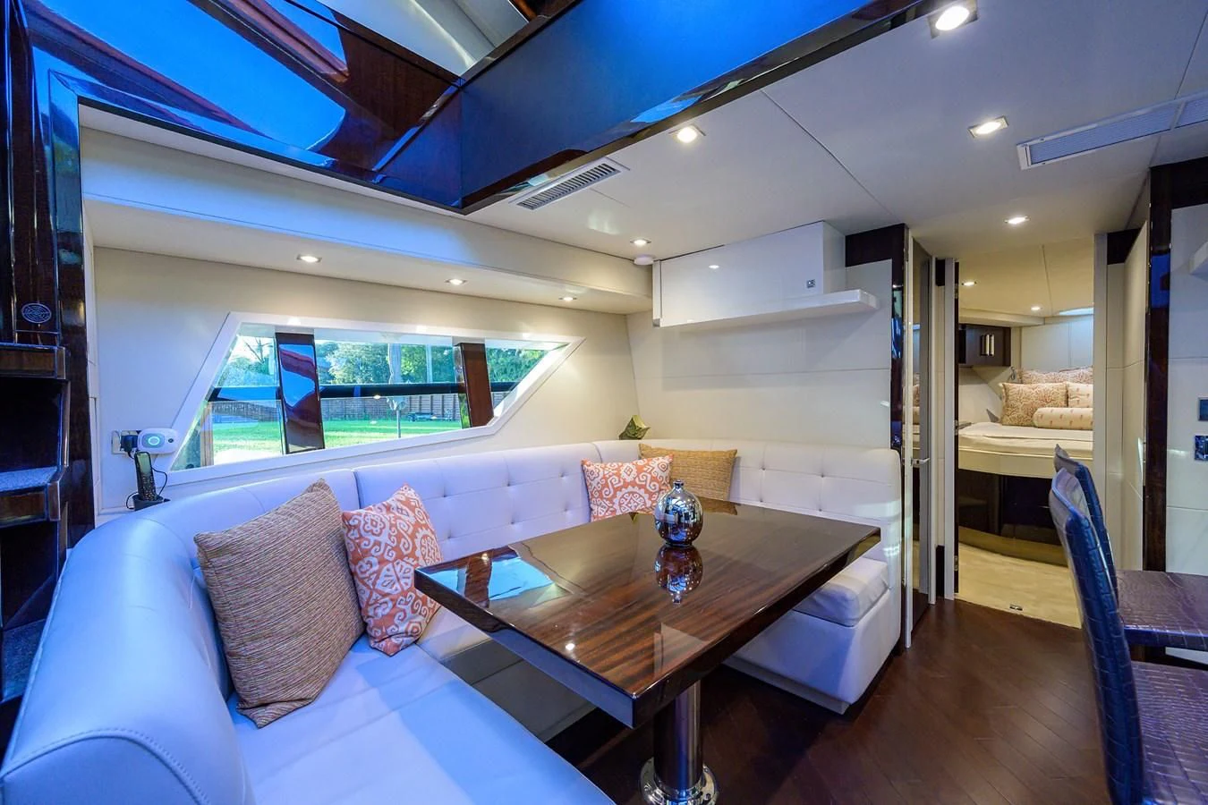 a living room with a table and couches aboard LADY NADIA Yacht for Sale