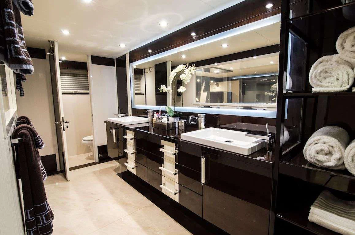 a large kitchen with a large mirror aboard LADY NADIA Yacht for Sale