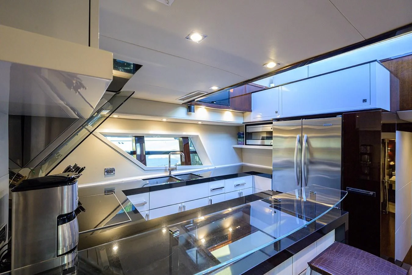 a kitchen with a large stainless steel oven and refrigerator aboard LADY NADIA Yacht for Sale
