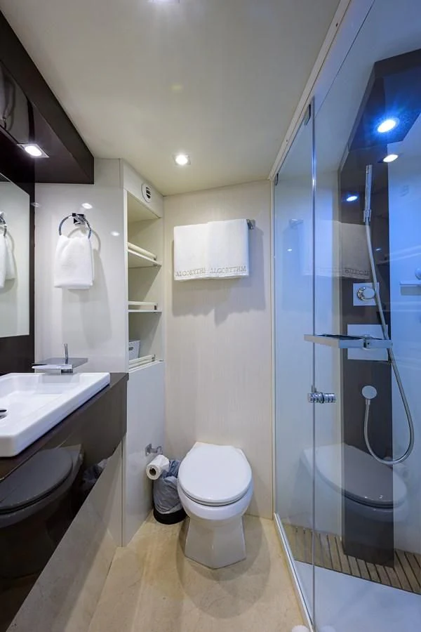 a bathroom with a glass shower aboard LADY NADIA Yacht for Sale