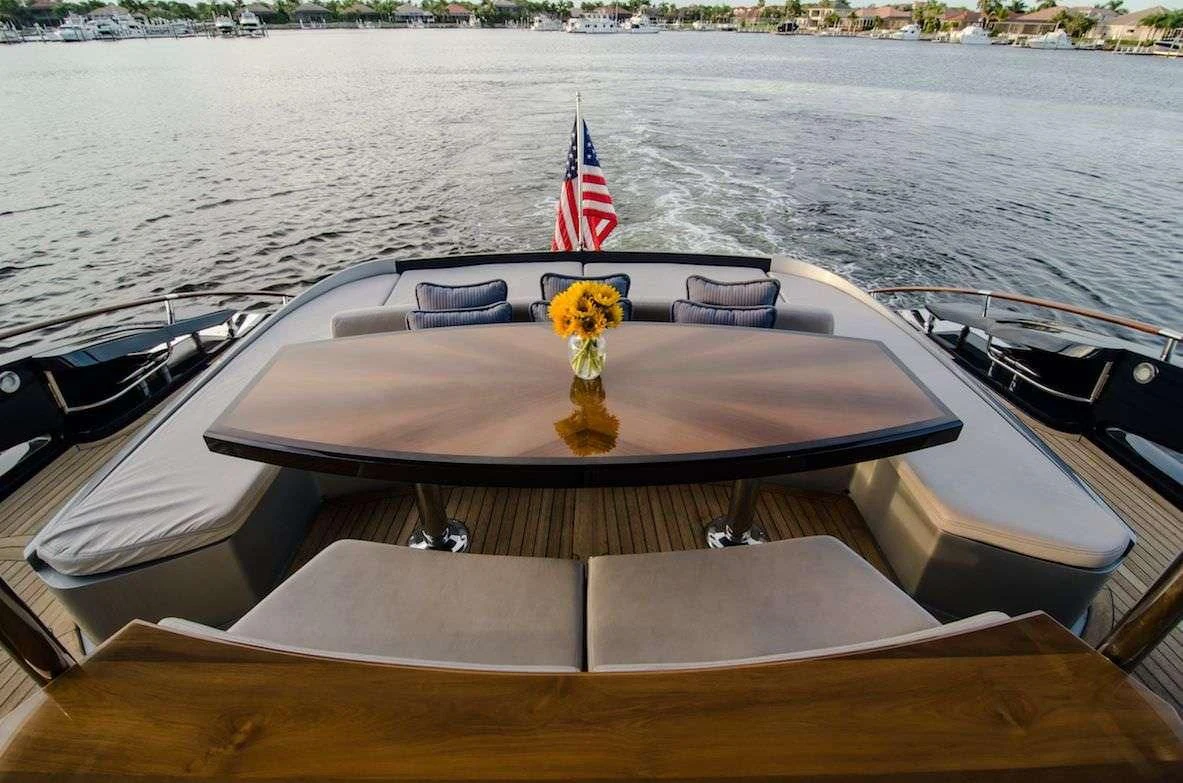 a boat with a flag on the front aboard LADY NADIA Yacht for Sale