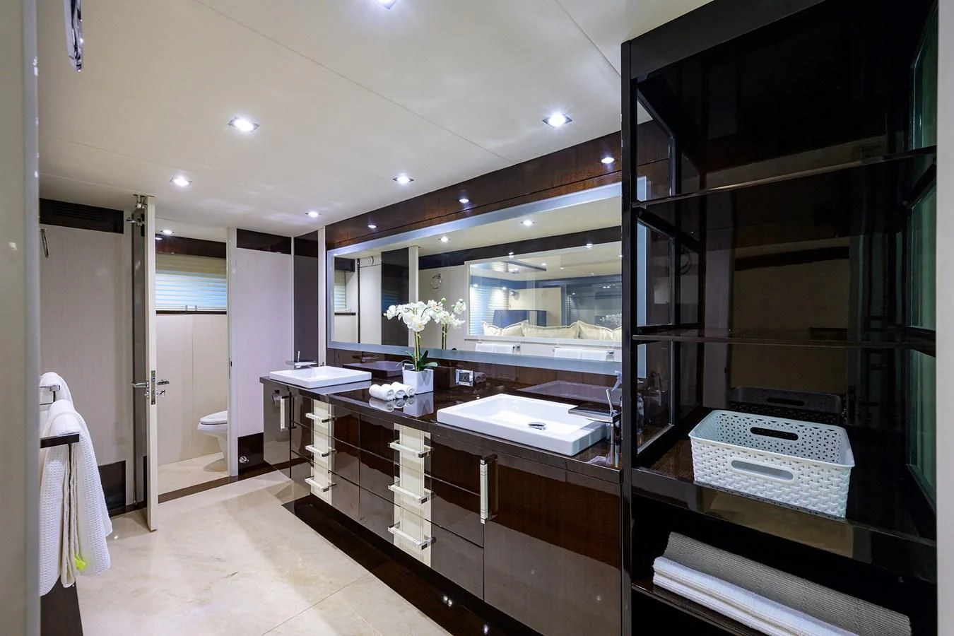 a bathroom with a countertop sink and cabinets aboard LADY NADIA Yacht for Sale