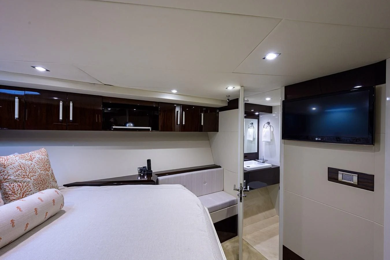 a bedroom with a large tv aboard LADY NADIA Yacht for Sale
