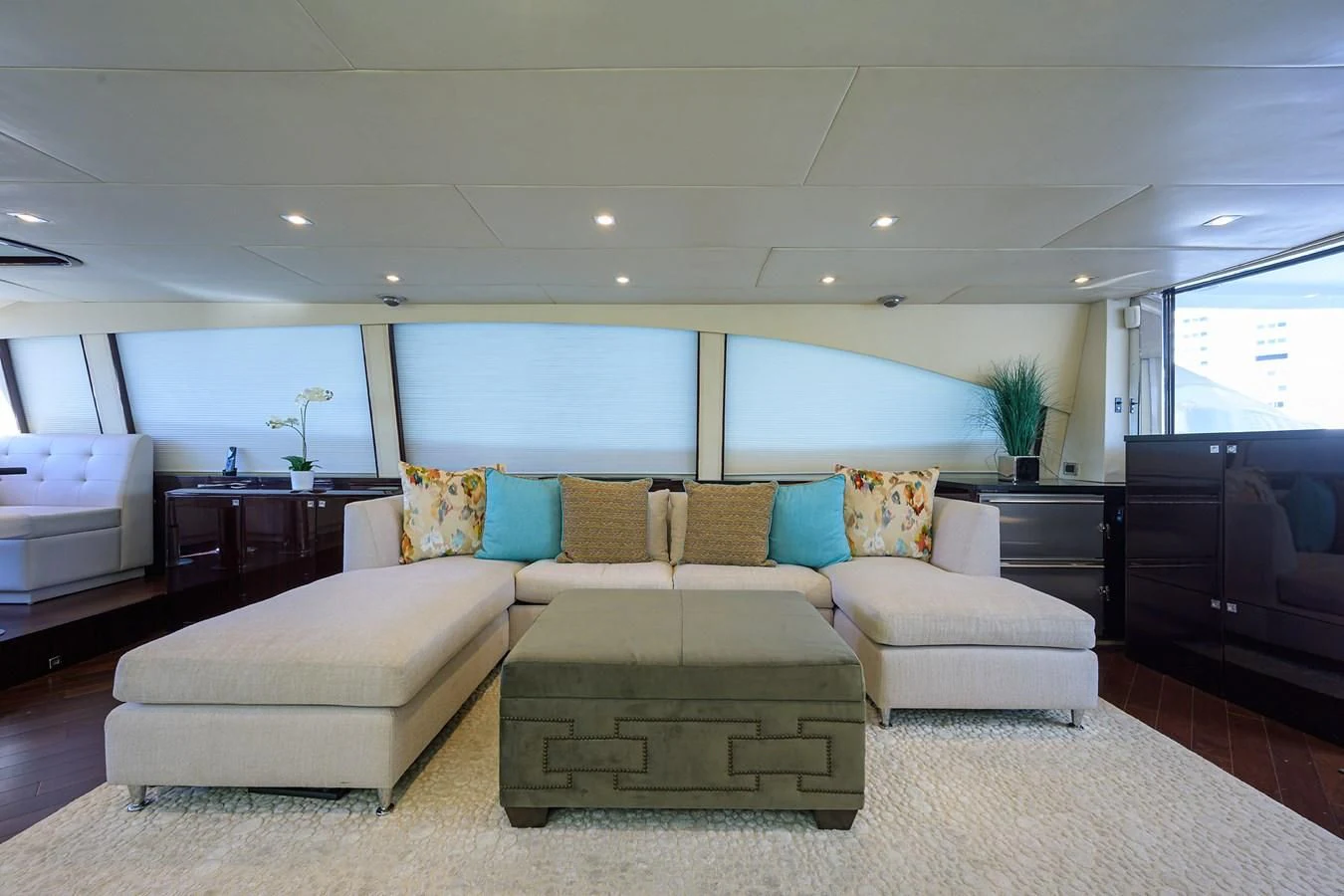 a living room with a couch and a table aboard LADY NADIA Yacht for Sale