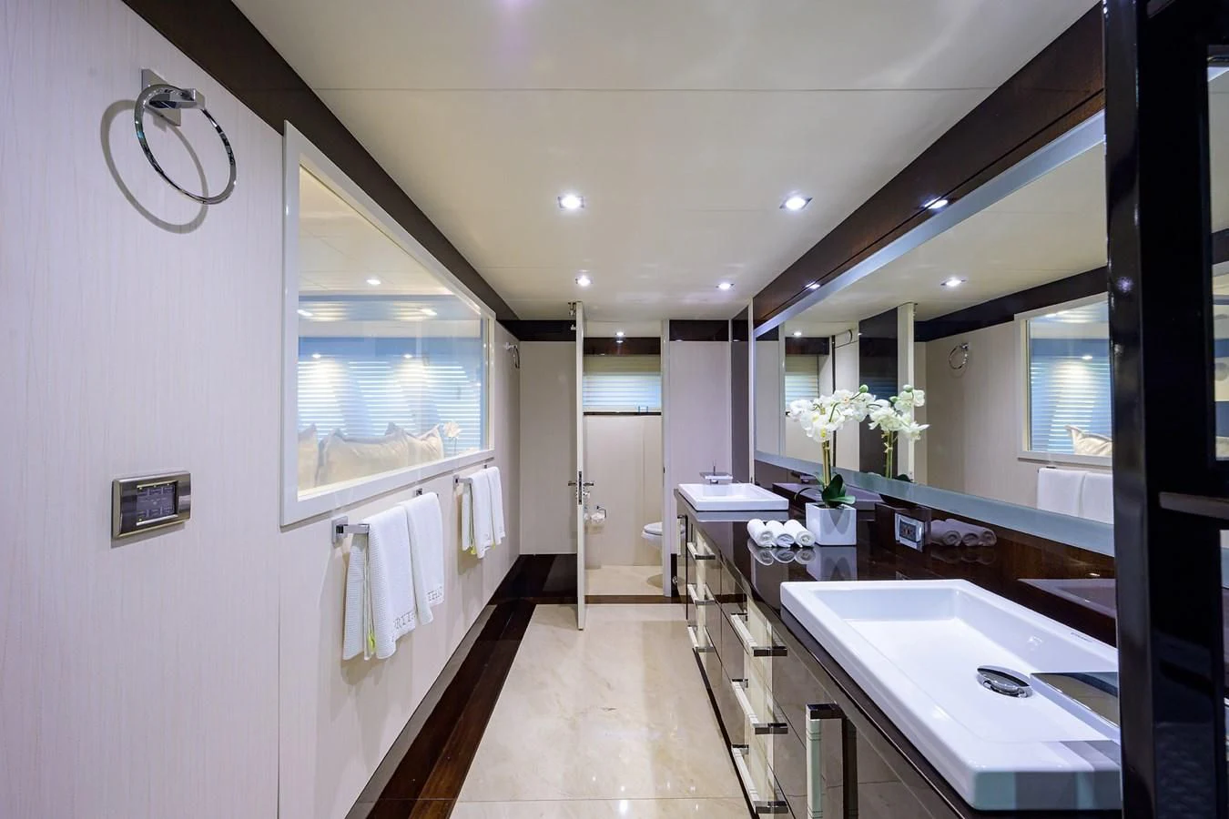 a bathroom with a large mirror aboard LADY NADIA Yacht for Sale