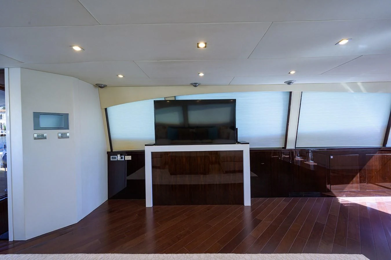 a room with a table and tv aboard LADY NADIA Yacht for Sale