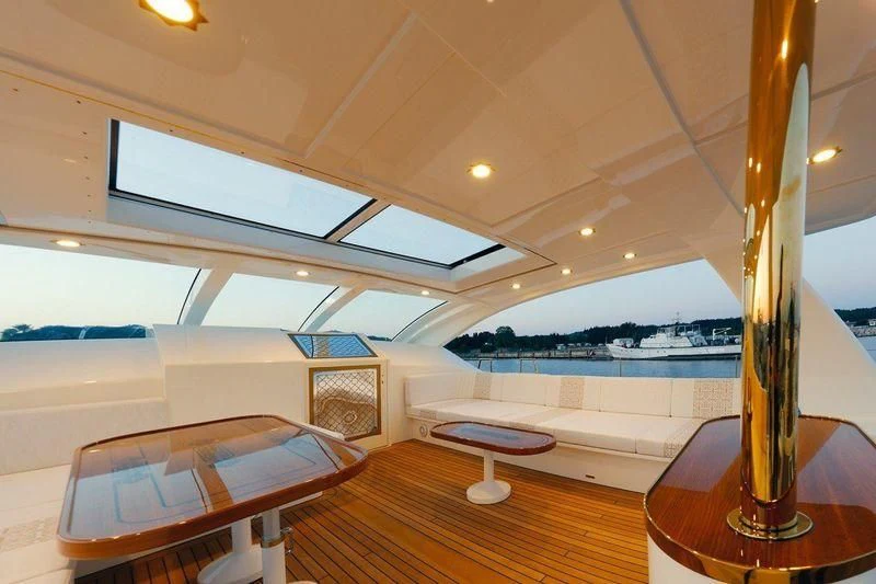 a room with a table and chairs aboard RUHUBELENT Yacht for Sale