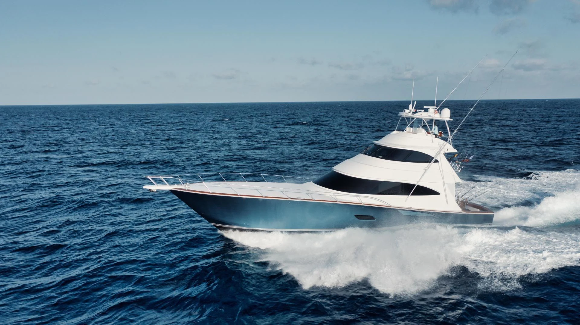 a white boat on the water aboard TAG TEAM Yacht for Sale