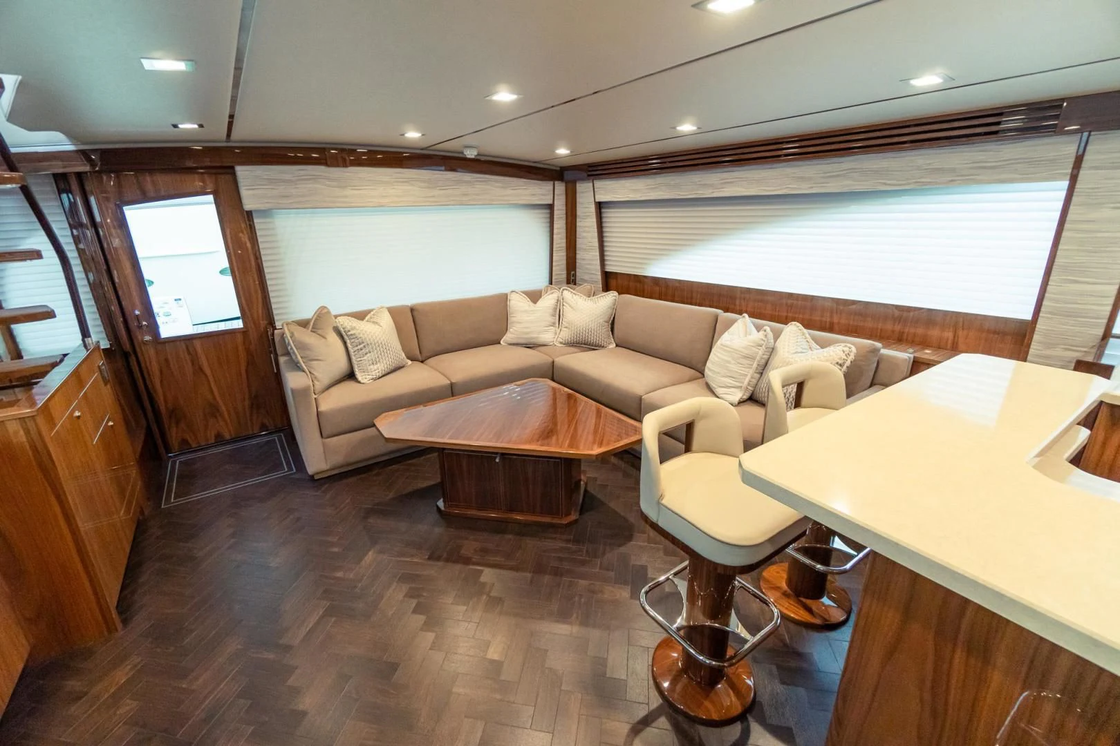 a living room with a couch and a table aboard TAG TEAM Yacht for Sale