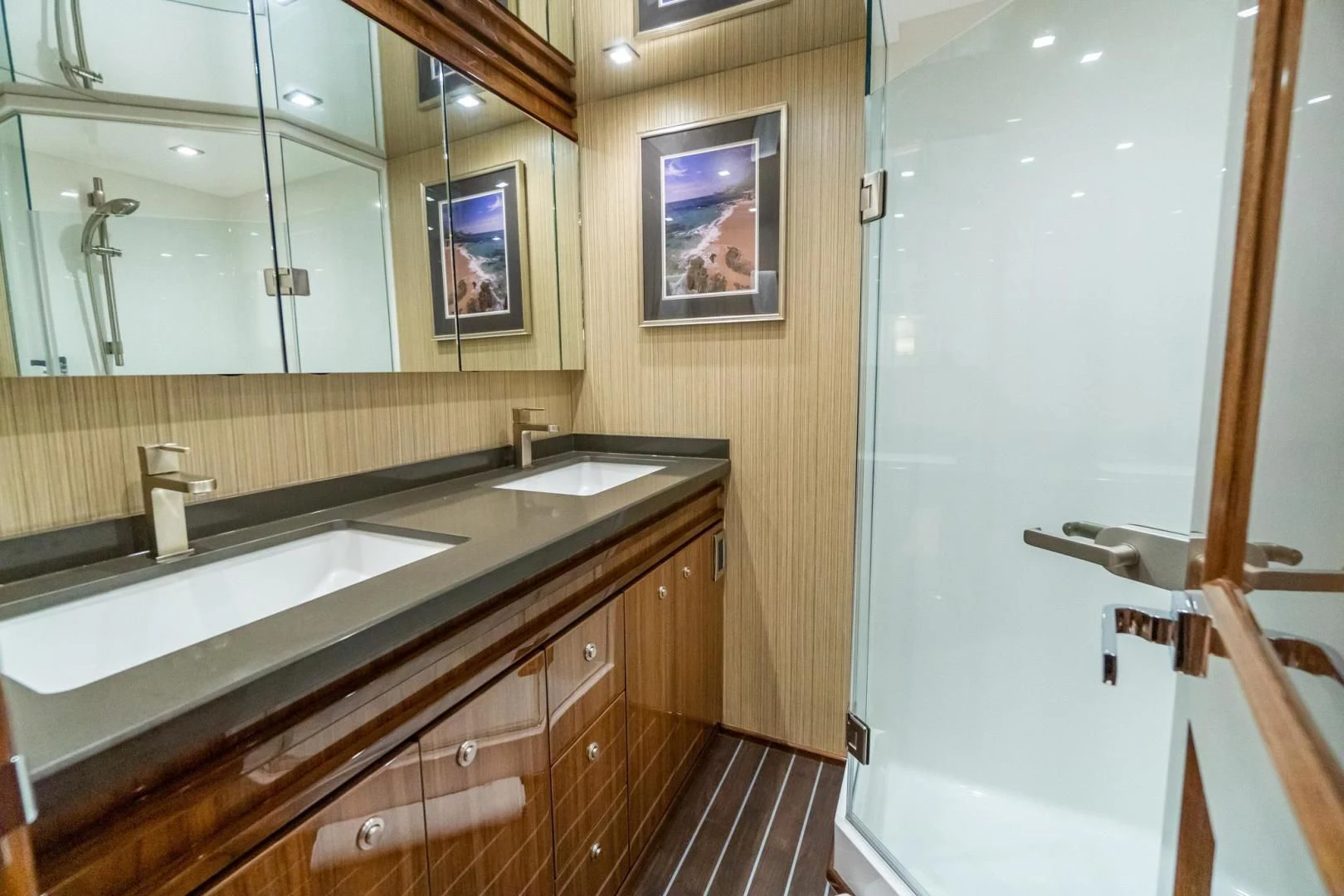 a bathroom with a large mirror aboard TAG TEAM Yacht for Sale