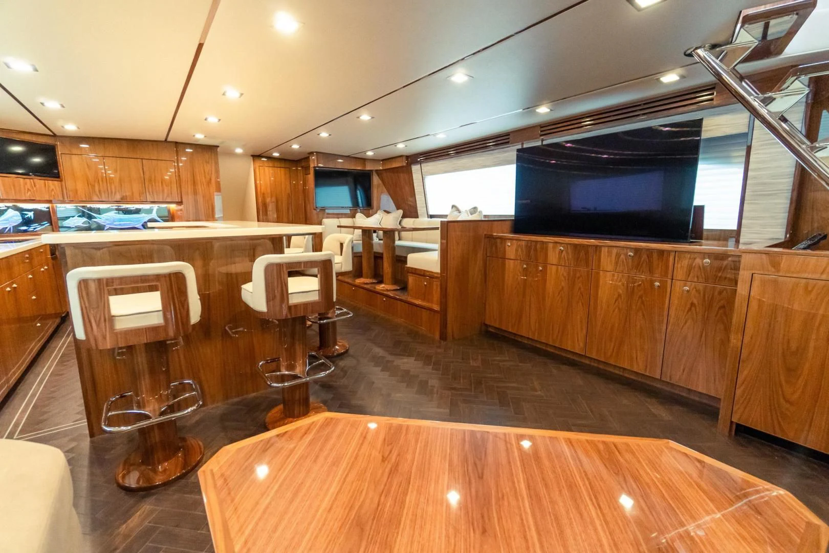a room with a wood floor and a tv on the wall aboard TAG TEAM Yacht for Sale